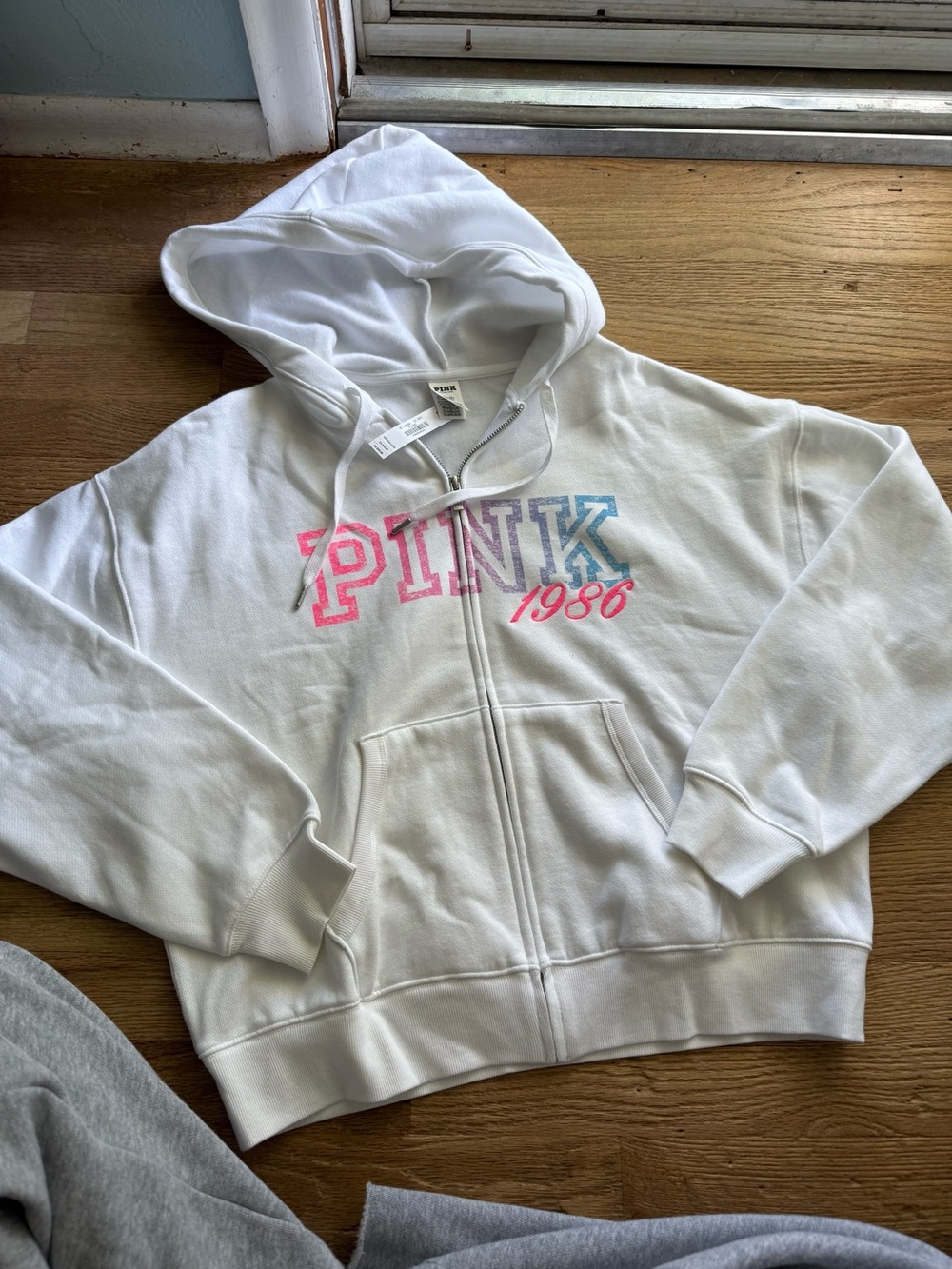 PINK Victoria's Secret White Zip-Up Hoodie with Pink & Blue Logo